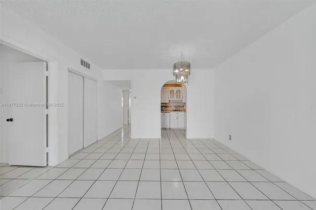 a view of an empty room and closet