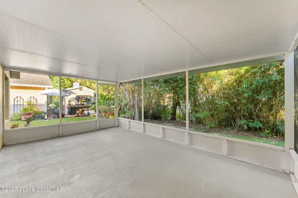 a view of empty room with sliding glass door