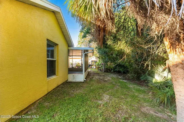 an aerial view of residential house with outdoor space and street view