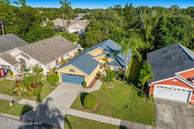 an aerial view of a house with a garden