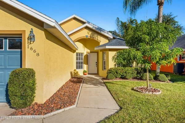 a kitchen with stainless steel appliances a refrigerator sink and cabinets