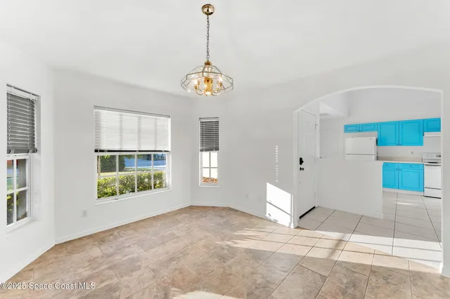 a kitchen with a stove top oven and cabinets
