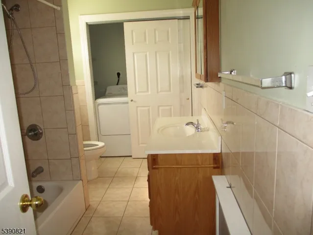 a bathroom with a bathtub and shower
