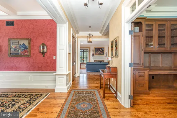 a living room with furniture and large windows