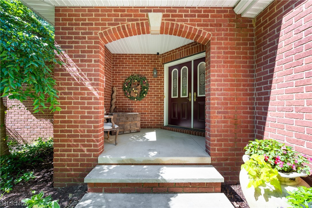 10400 Stoneacre Road Northwest Canal Fulton, OH 44614 - Photo 3 of 44 Entrance to property with a porch and brick siding