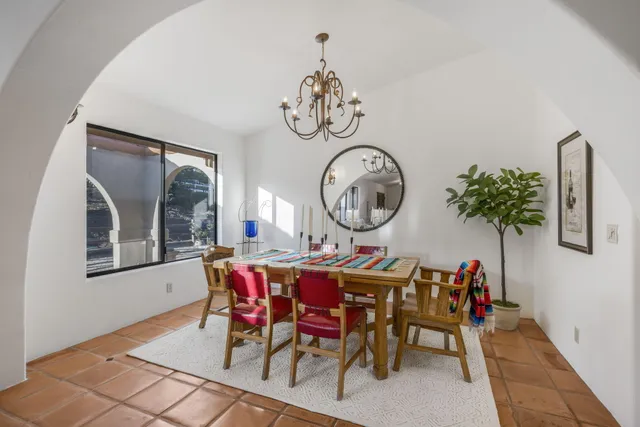 a kitchen with cabinets stainless steel appliances and a window