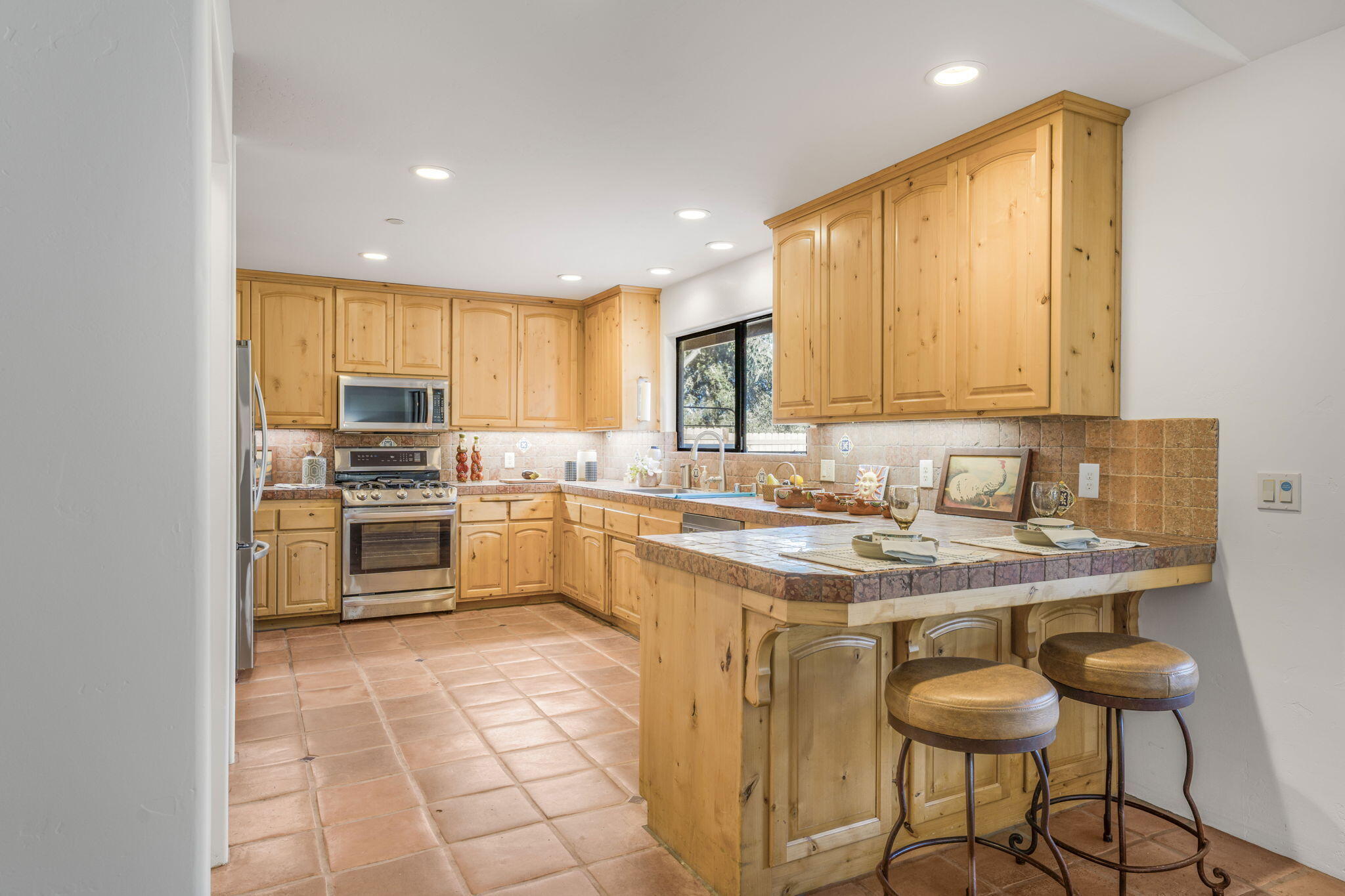 80 Bobcat Springs Road Buellton, CA 93427 - Photo 17 of 72 a kitchen with a sink a counter top space cabinets and stainless steel appliances