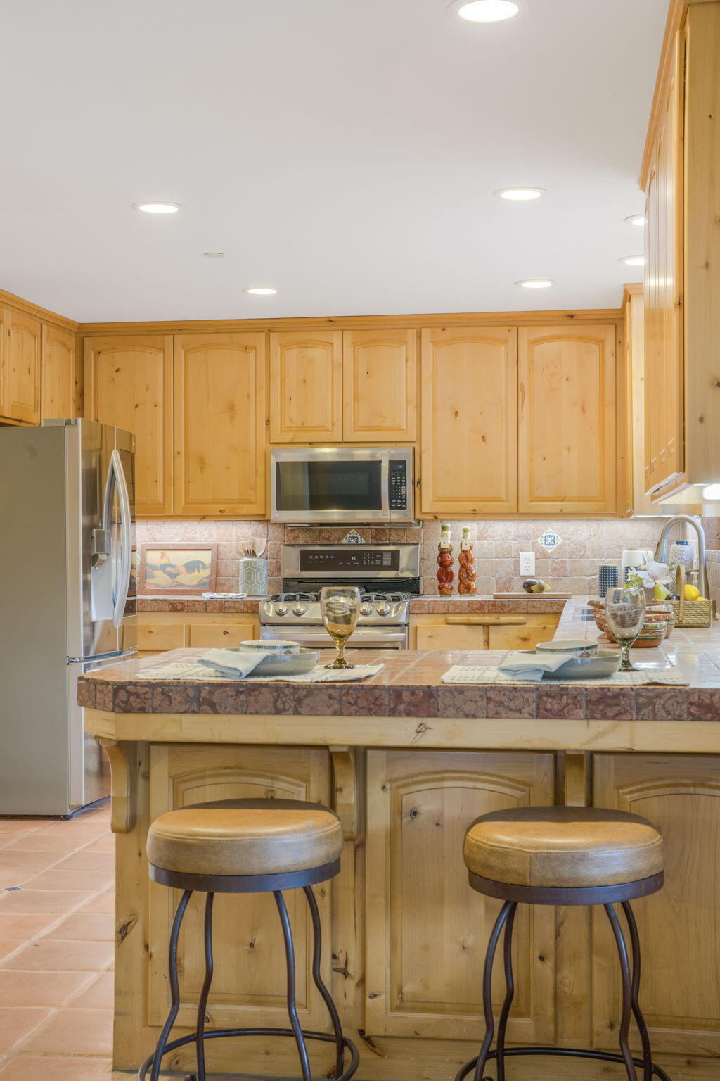 80 Bobcat Springs Road Buellton, CA 93427 - Photo 18 of 72 a kitchen with stainless steel appliances granite countertop a table chairs sink and cabinets