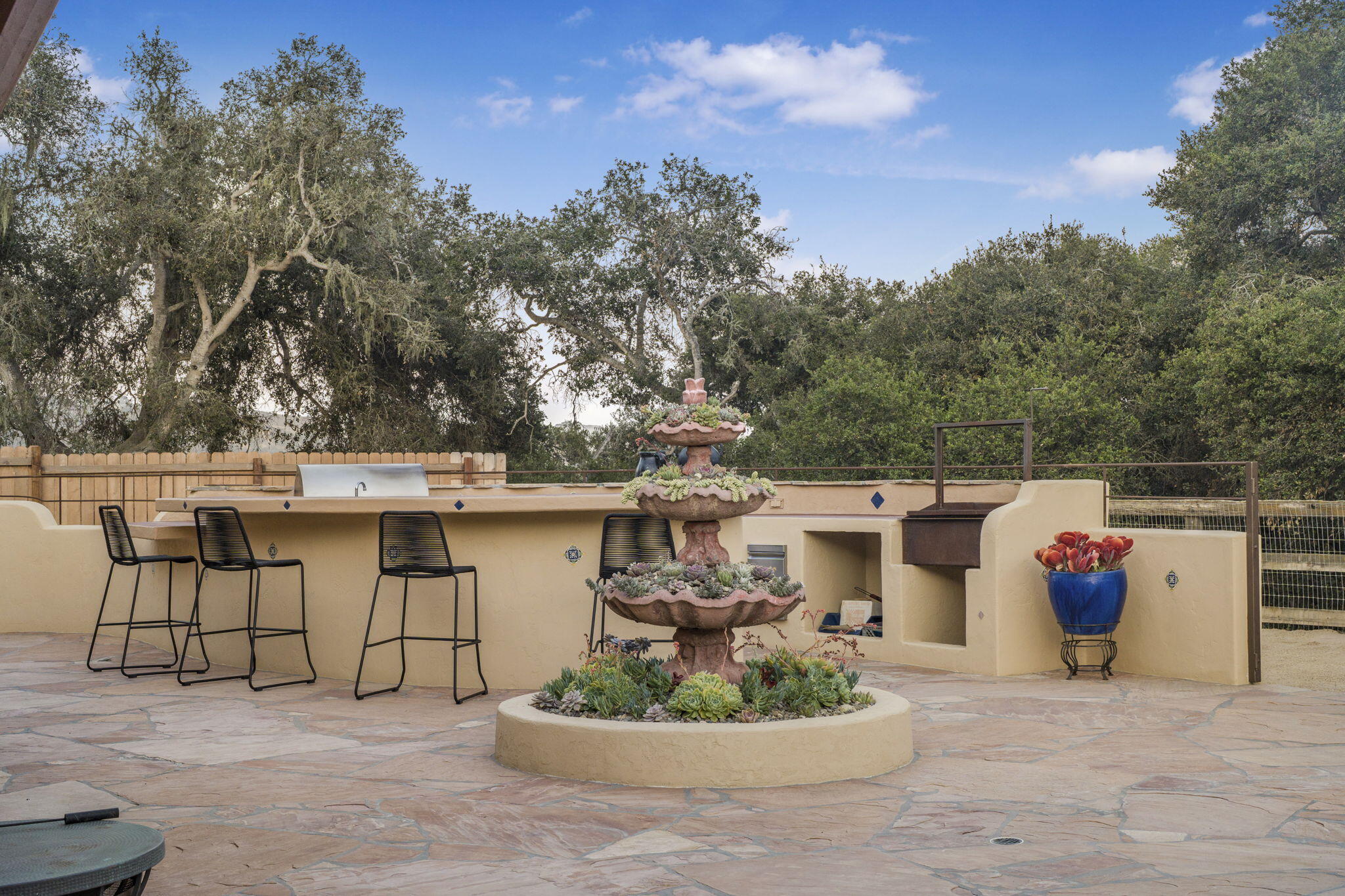 80 Bobcat Springs Road Buellton, CA 93427 - Photo 27 of 72 a view of a white house with a sink and a potted plant