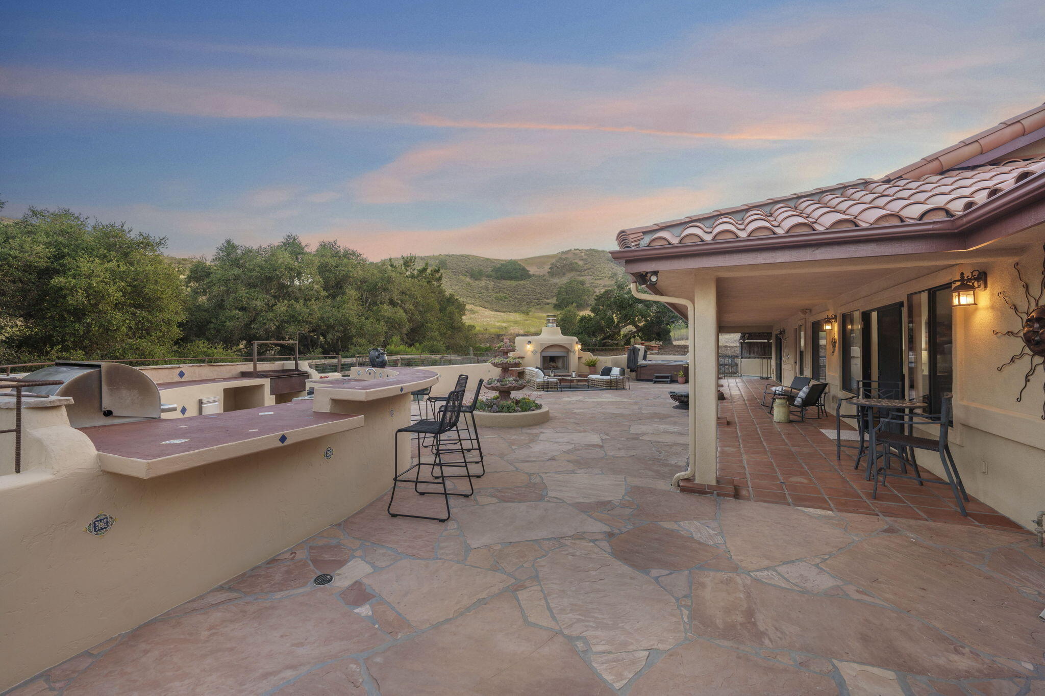 80 Bobcat Springs Road Buellton, CA 93427 - Photo 28 of 72 a view of a patio with dining table and chairs with wooden floor