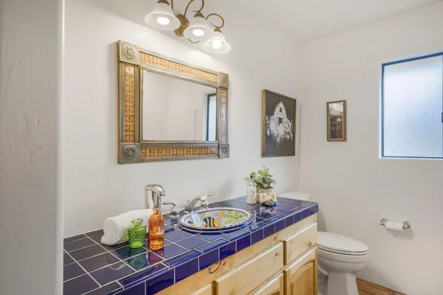 an aerial view of a house with a yard and lake view