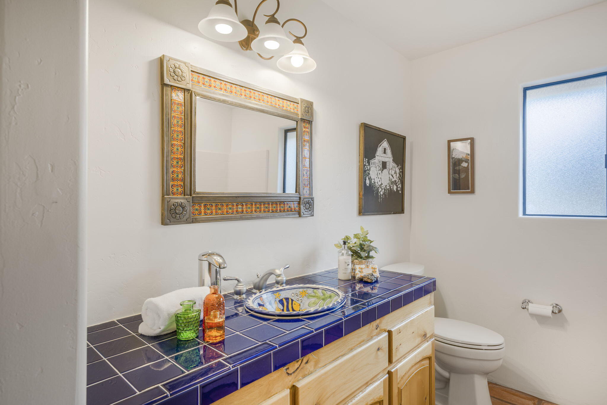 80 Bobcat Springs Road Buellton, CA 93427 - Photo 38 of 72 a bathroom with a toilet a sink and mirror