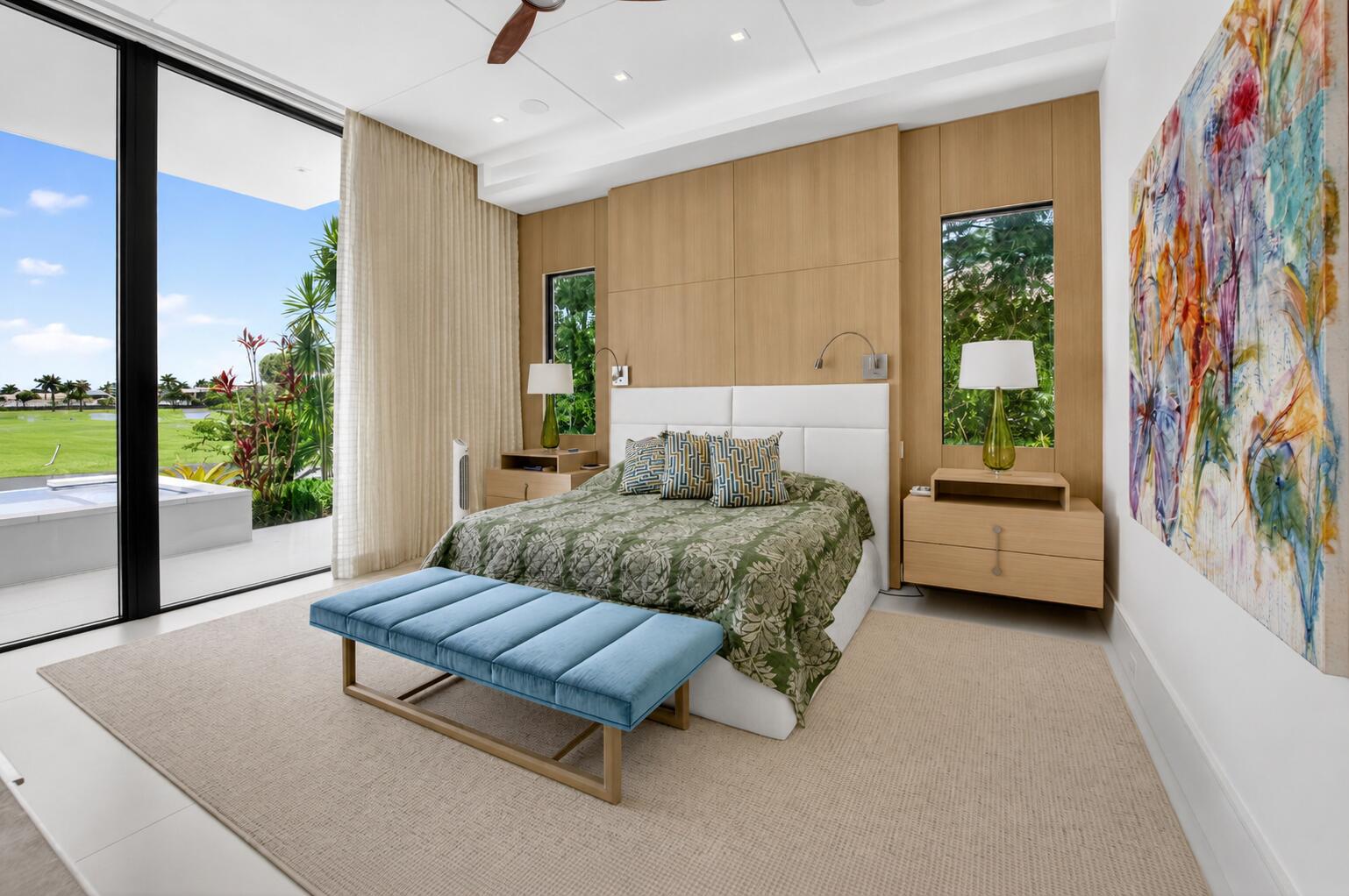 6960 Lake Estates Court Boca Raton, FL 33496 - Photo 18 of 58 a bedroom with a bed and a couch next to a window