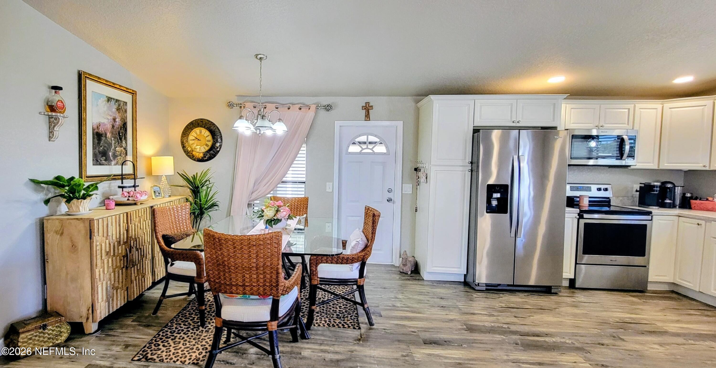 148 Rio Grande Edgewater, FL 32141 - Photo 12 of 74 a view of a dining room with furniture window and wooden floor