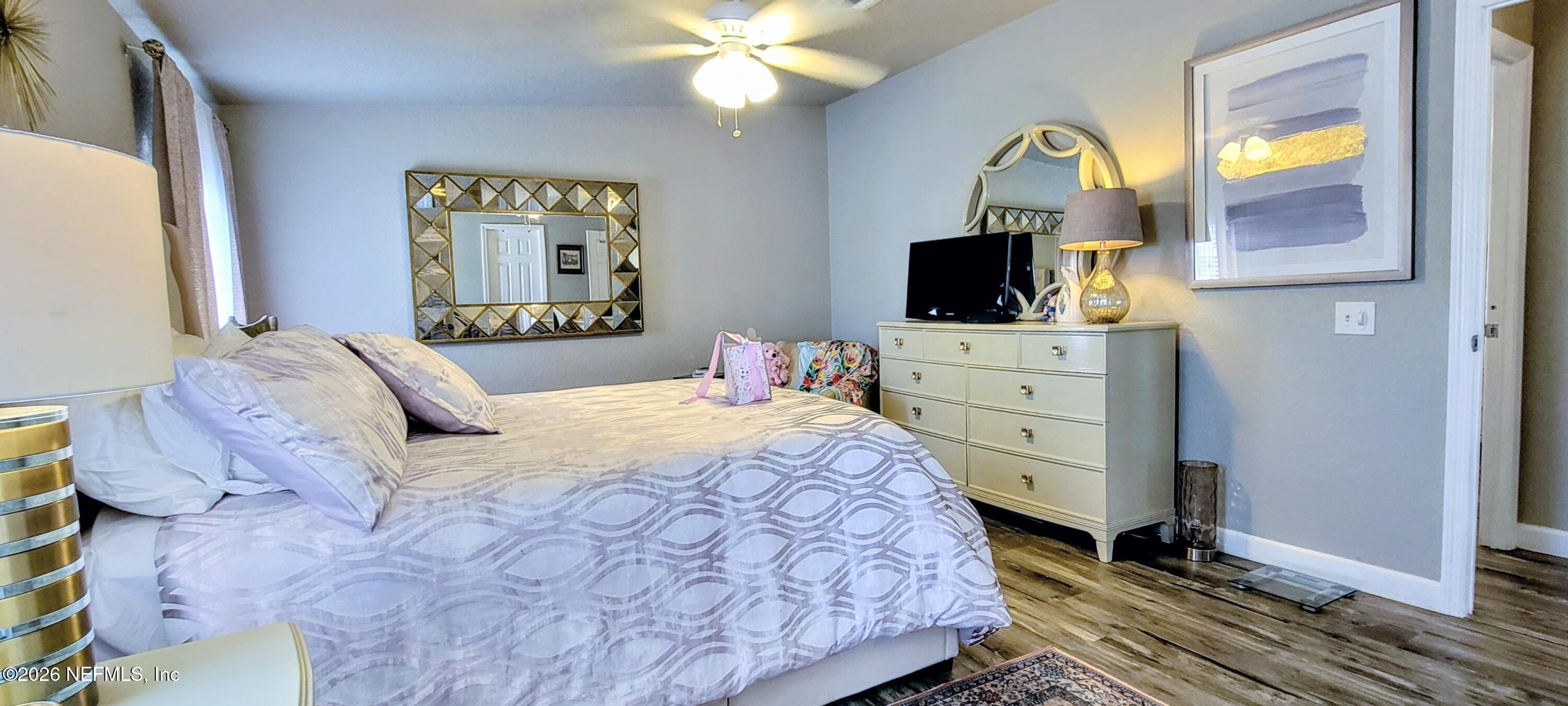 148 Rio Grande Edgewater, FL 32141 - Photo 37 of 74 a bedroom with a bed and a flat screen tv