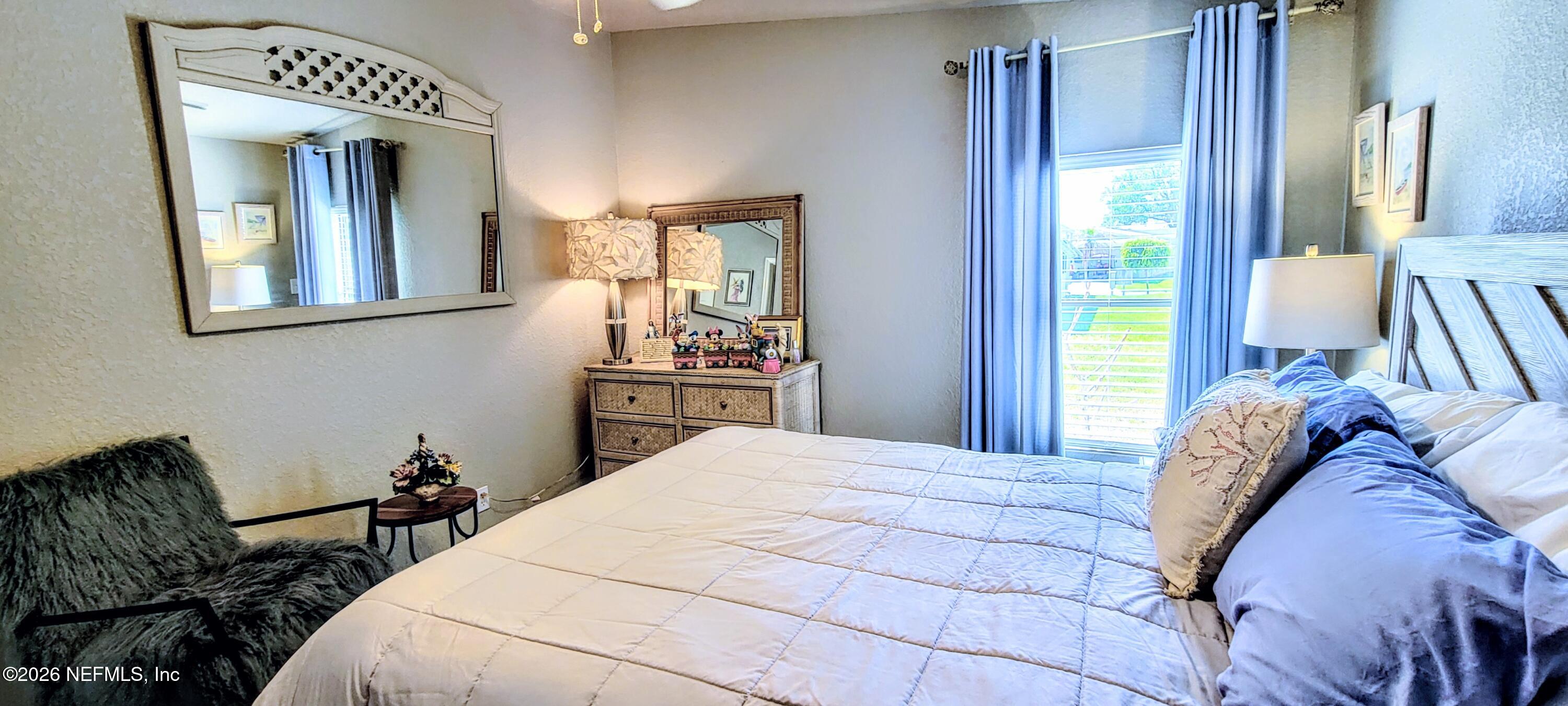 148 Rio Grande Edgewater, FL 32141 - Photo 42 of 74 a bed sitting in a bedroom next to a window