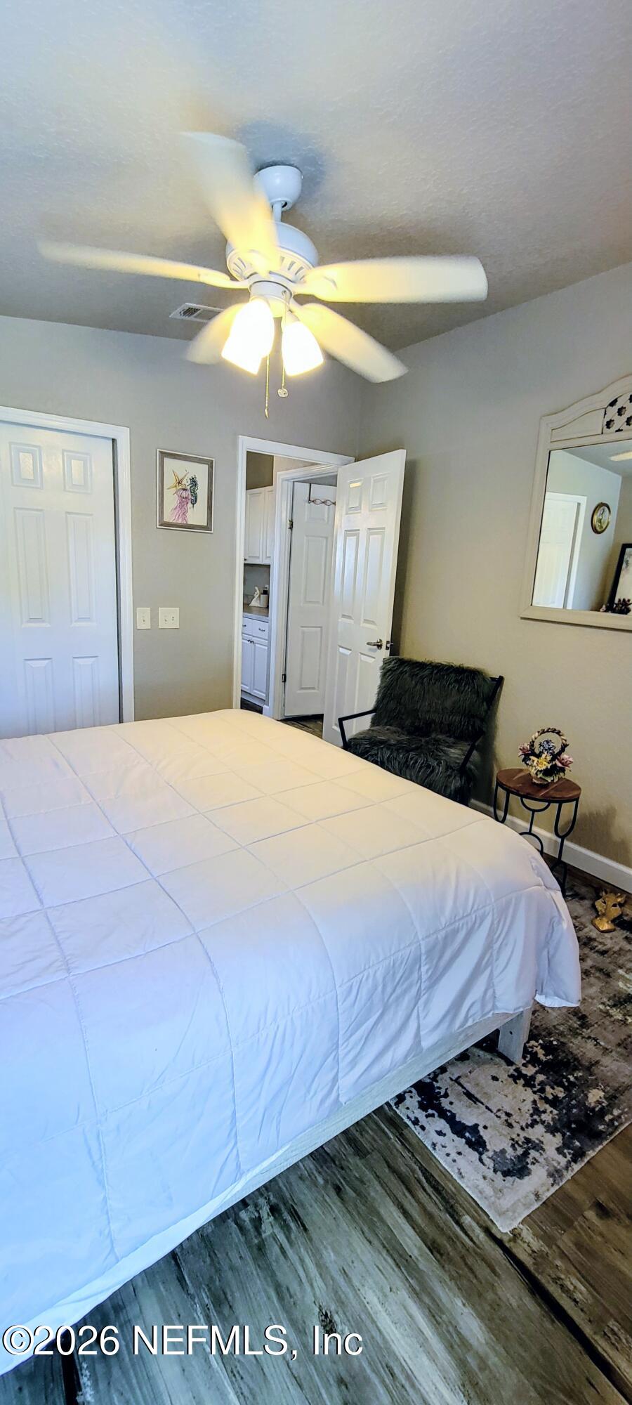 148 Rio Grande Edgewater, FL 32141 - Photo 44 of 74 a bedroom with a bed and a chandelier