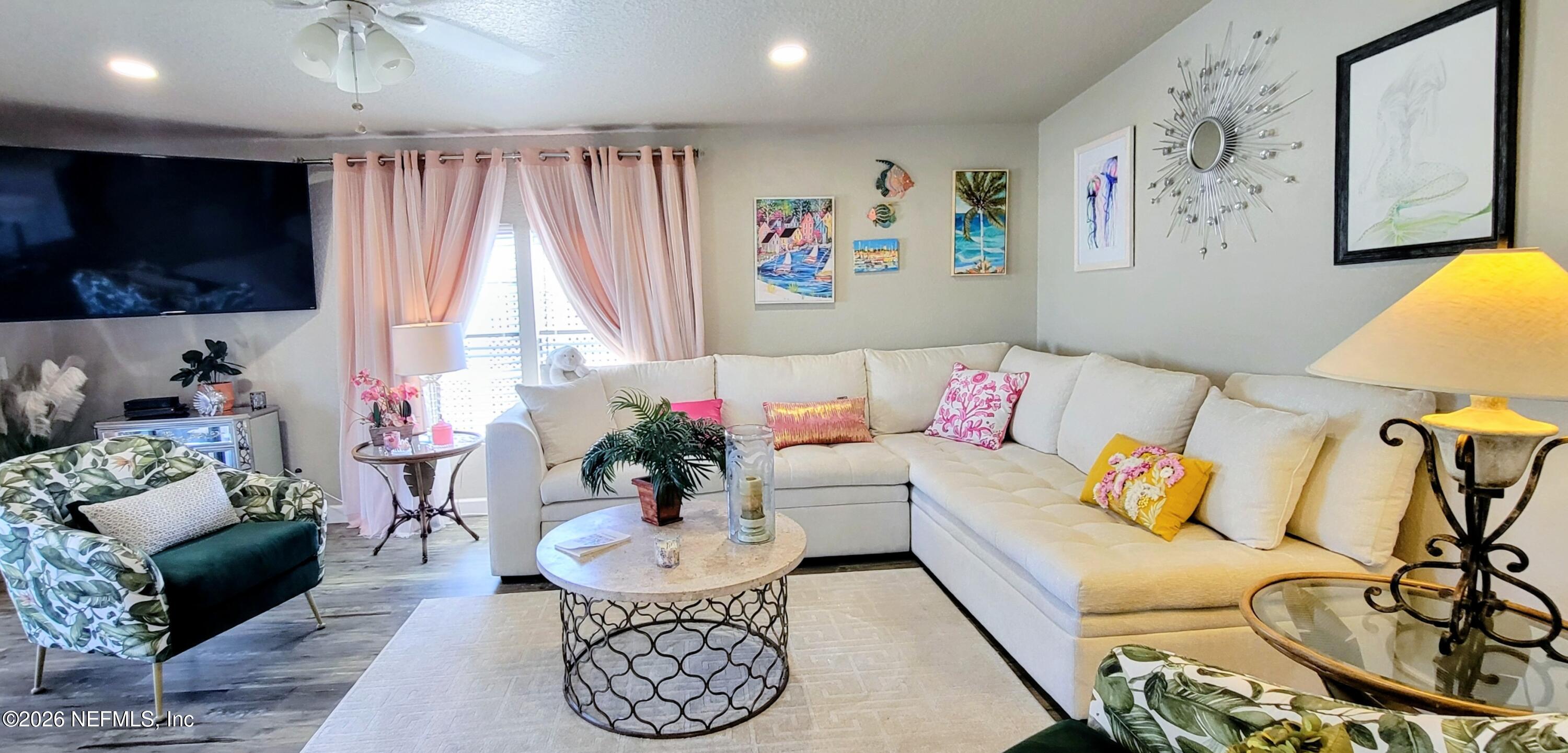 148 Rio Grande Edgewater, FL 32141 - Photo 48 of 74 a living room with furniture and a flat screen tv