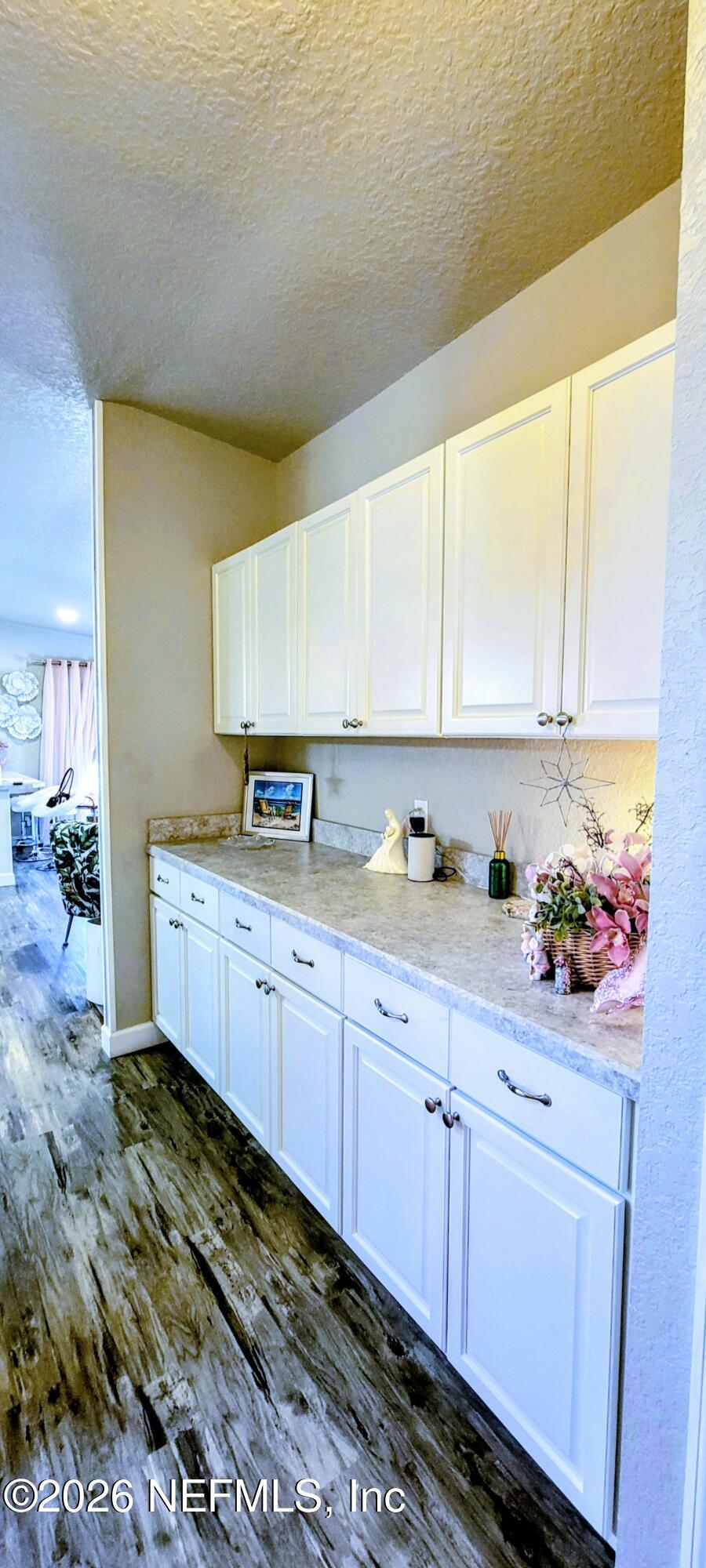 148 Rio Grande Edgewater, FL 32141 - Photo 8 of 74 a kitchen with granite countertop a sink and cabinets