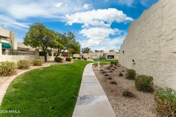 a view of a park with houses