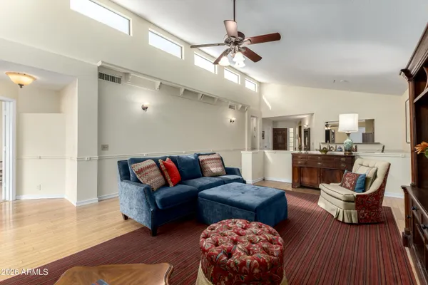 a bedroom with furniture and a rug