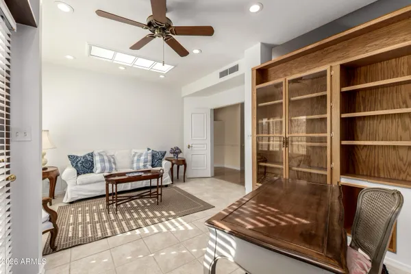 a living room with furniture and a window