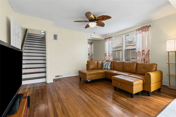 a living room with furniture and a flat screen tv
