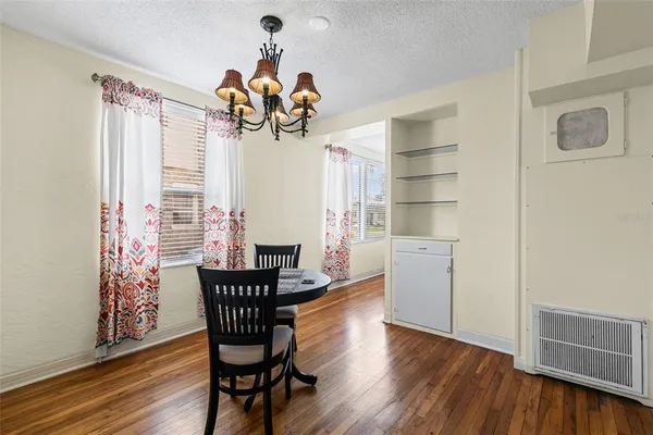 a kitchen with a refrigerator and a sink
