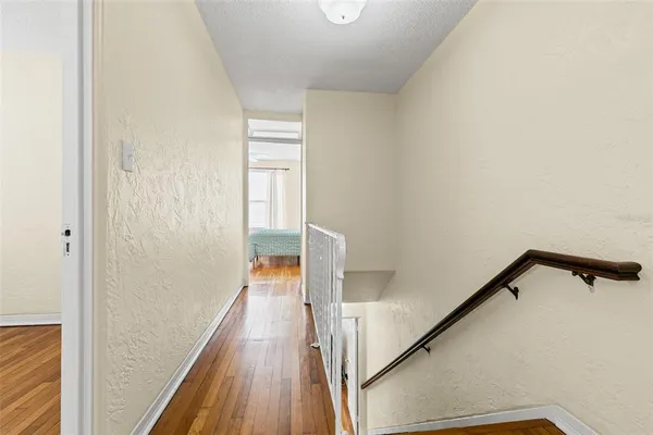 a bedroom with a large bed and a large window