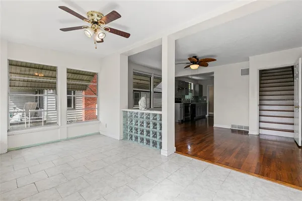 a view of an empty room with a window