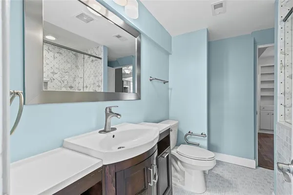 a bathroom with a shower and a sink