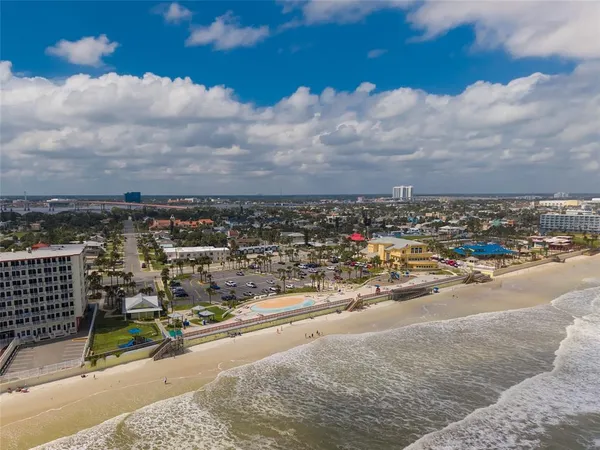 a front view of a house with a yard table and chairs
