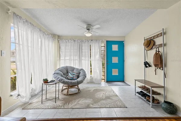 a living room with furniture and a large window