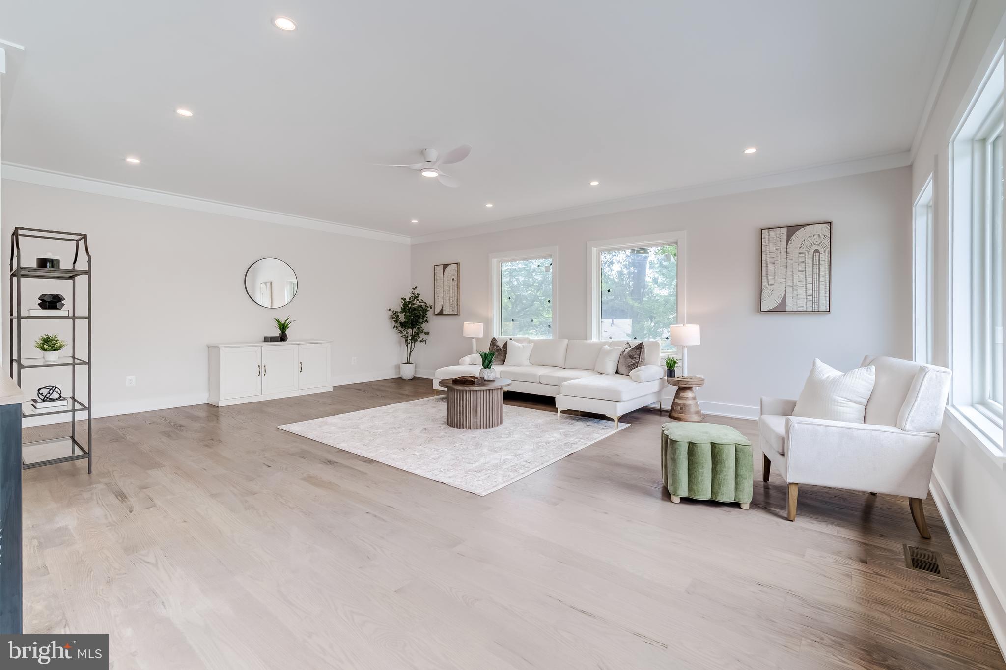 506 Kingsley Road Southwest Vienna, VA 22180 - Photo 111 of 150 a living room with couches and kitchen view with wooden floor