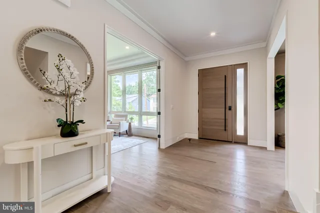a view of a hallway with a livingroom and a dinning area