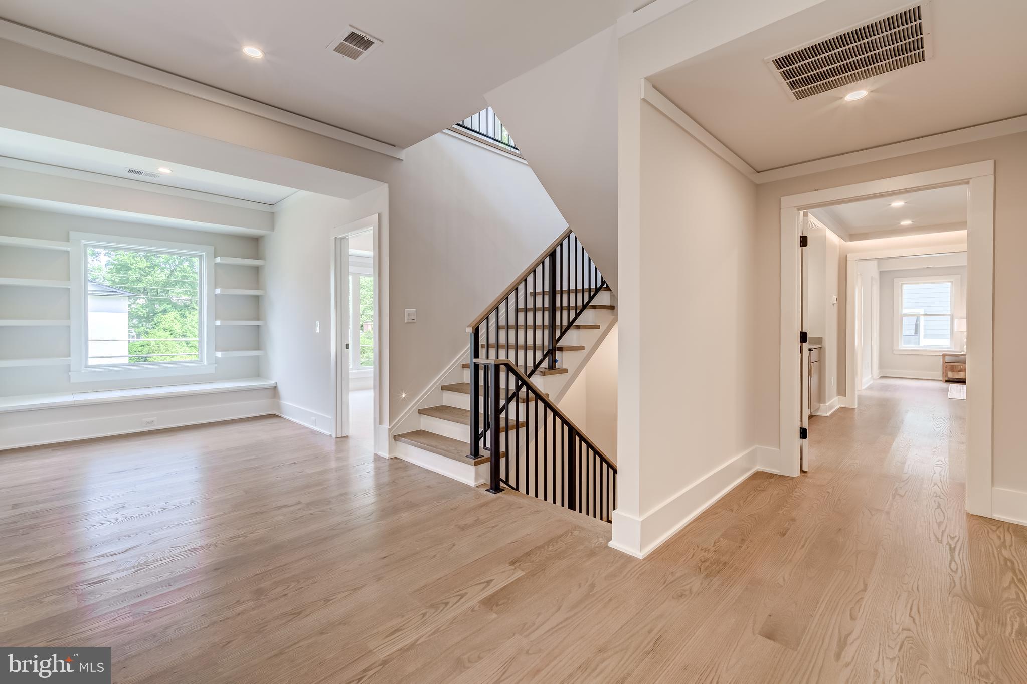 506 Kingsley Road Southwest Vienna, VA 22180 - Photo 68 of 150 a view of a hallway with wooden floor and stairs