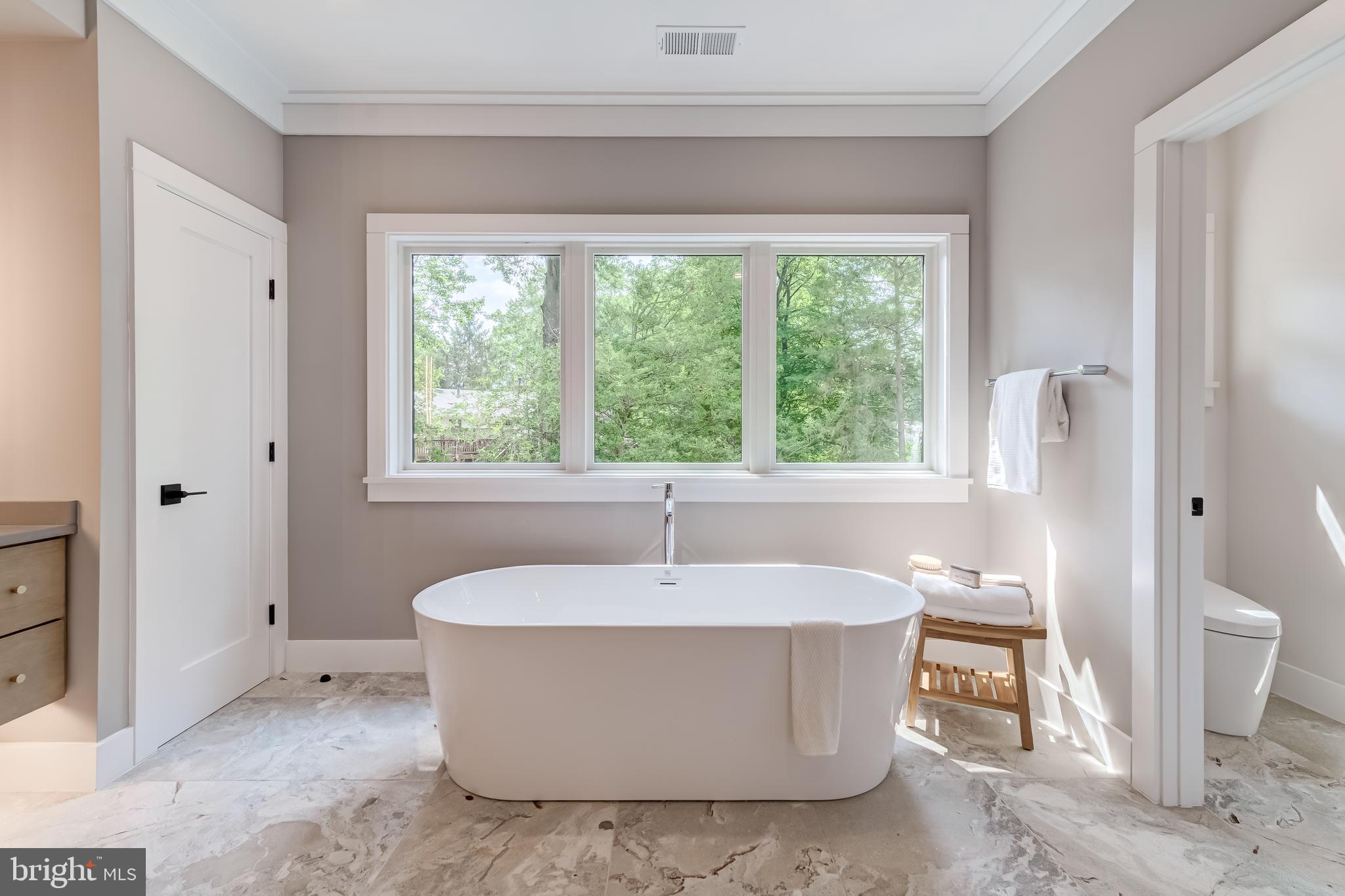 506 Kingsley Road Southwest Vienna, VA 22180 - Photo 74 of 150 a white bath tub sitting in a bathroom next to a window