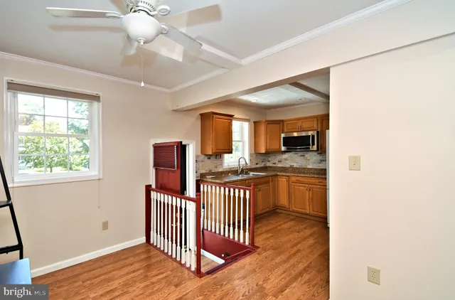 a kitchen with stainless steel appliances a stove a sink and a refrigerator