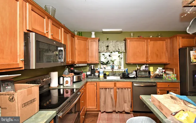 a view of a workspace with furniture and wooden floor
