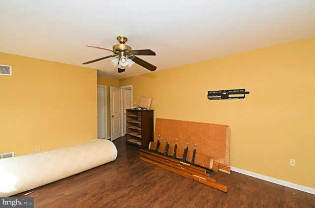 a view of a patio with table and chairs and potted plants