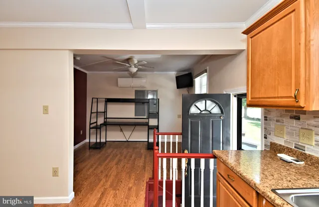 a view of a livingroom with furniture and window