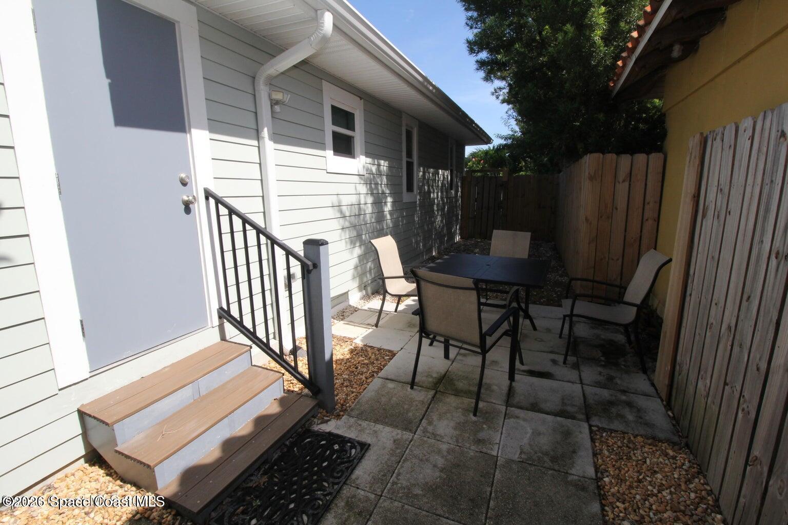 1935 Oak Street Melbourne, FL 32901 - Photo 13 of 13 a view of balcony with furniture and wooden fence