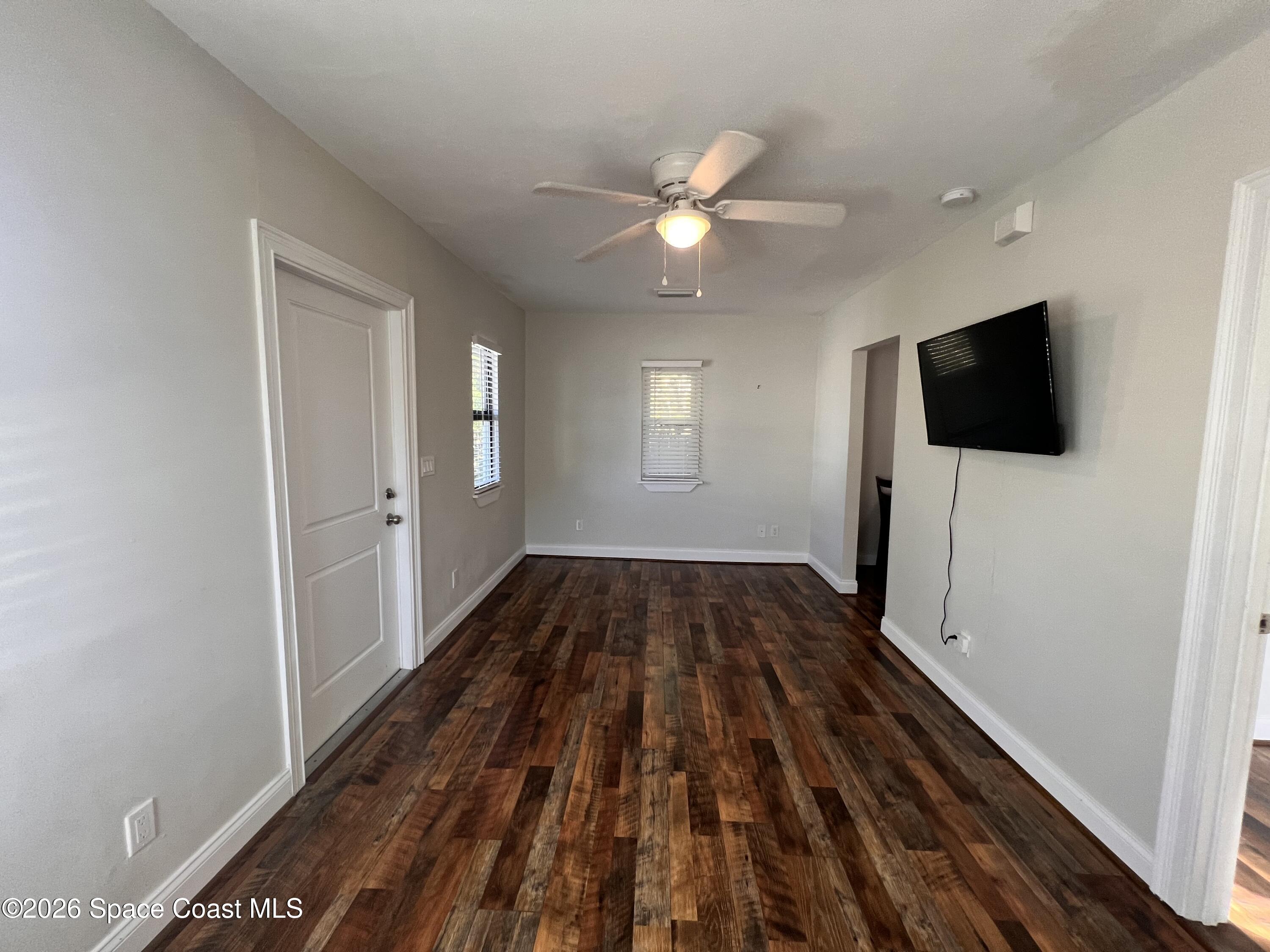 1935 Oak Street Melbourne, FL 32901 - Photo 4 of 13 a view of a livingroom with a flat tv screen and dresser