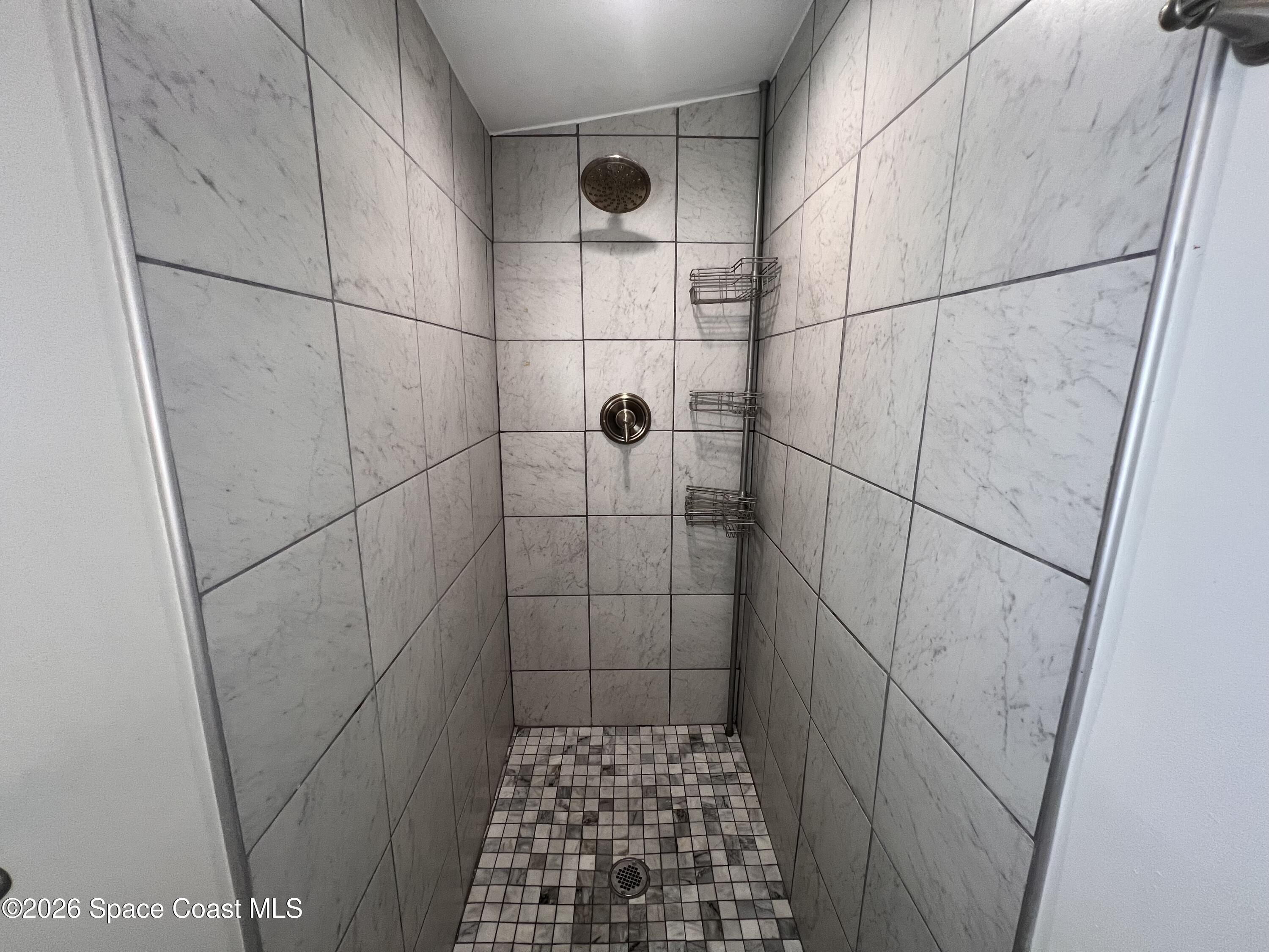 1935 Oak Street Melbourne, FL 32901 - Photo 10 of 13 a bathroom with a shower