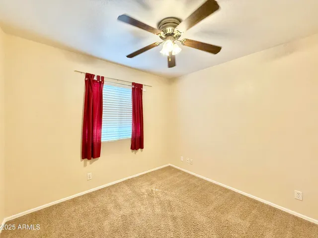 a very nice looking room with a ceiling fan