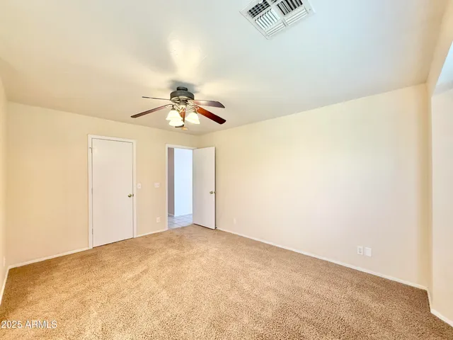 a view of a big room with carpet