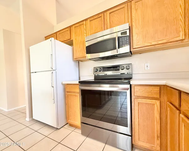 a kitchen with a stove and a microwave