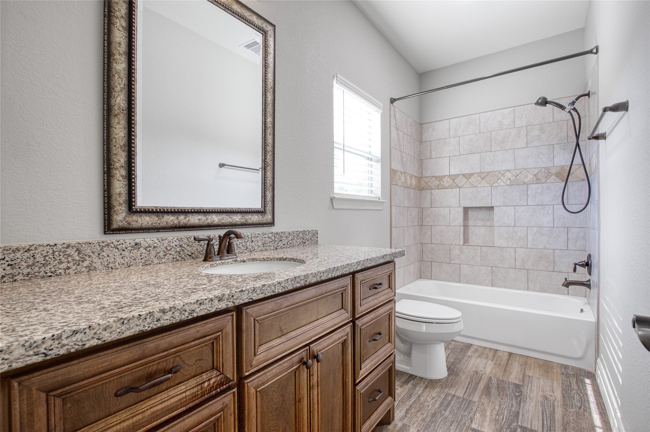 27684 Rio Blanco Drive Splendora, TX 77372 - Photo 19 of 31 a bathroom with a granite countertop sink toilet and shower