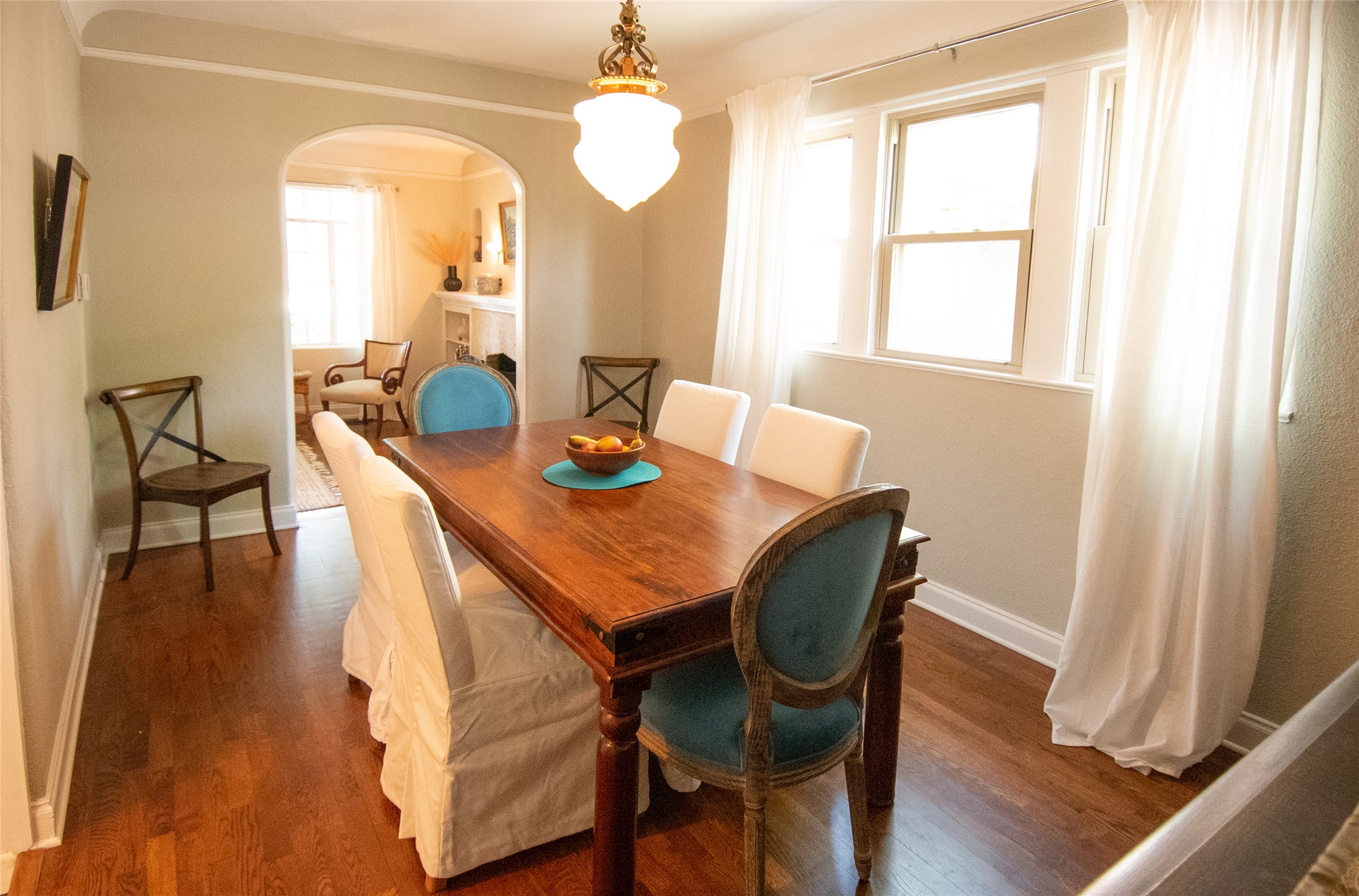 1512 Northwood Road Austin, TX 78703 - Photo 14 of 24 Dining room featuring arched walkways and dark wood finished floors