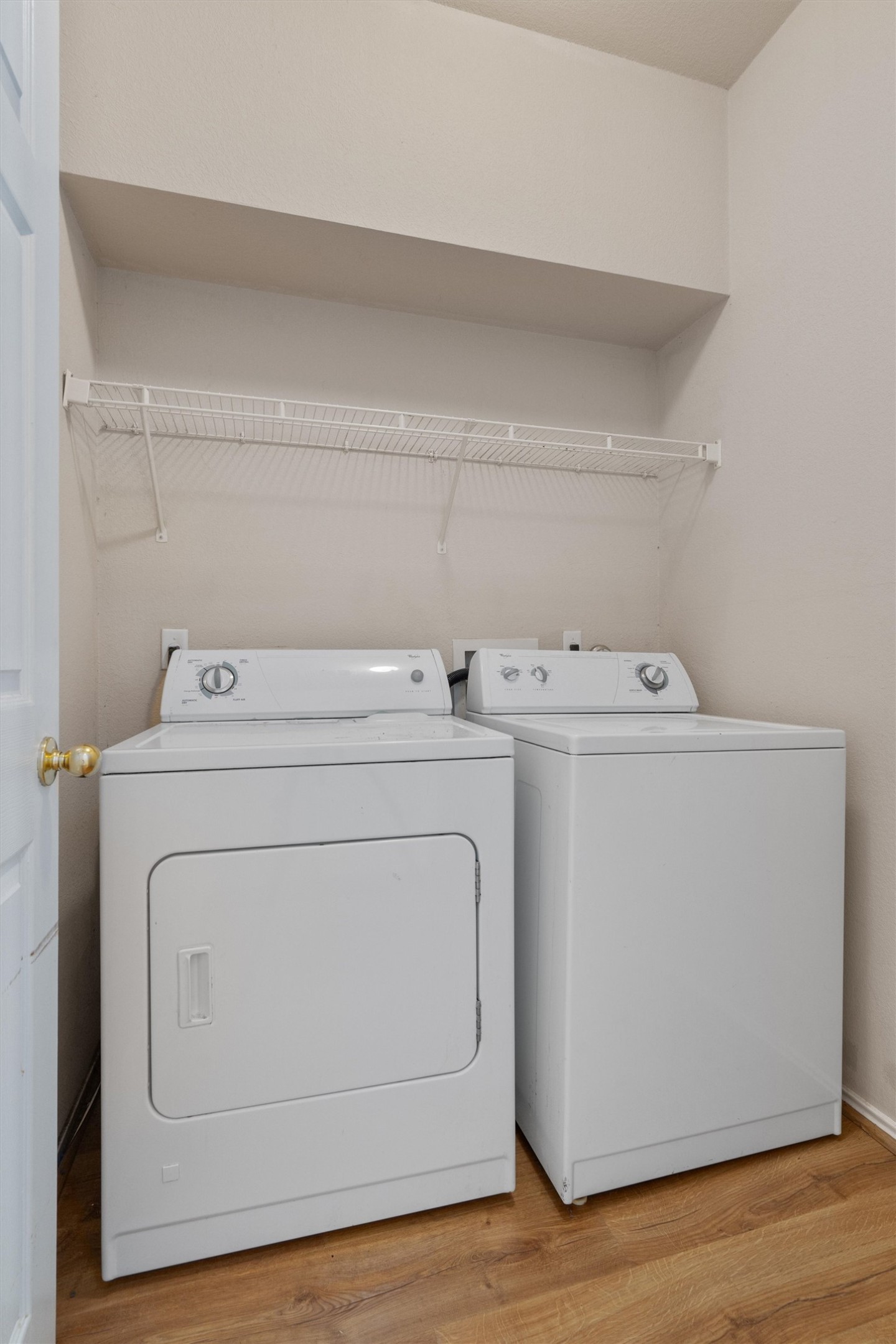 13720 Harris Ridge Boulevard, Unit A Pflugerville, TX 78660 - Photo 11 of 27 Laundry room with light wood finished floors and independent washer and dryer